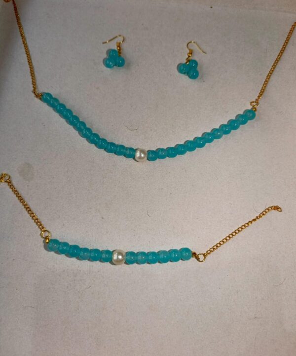 aqua blue beaded set with pearl accents