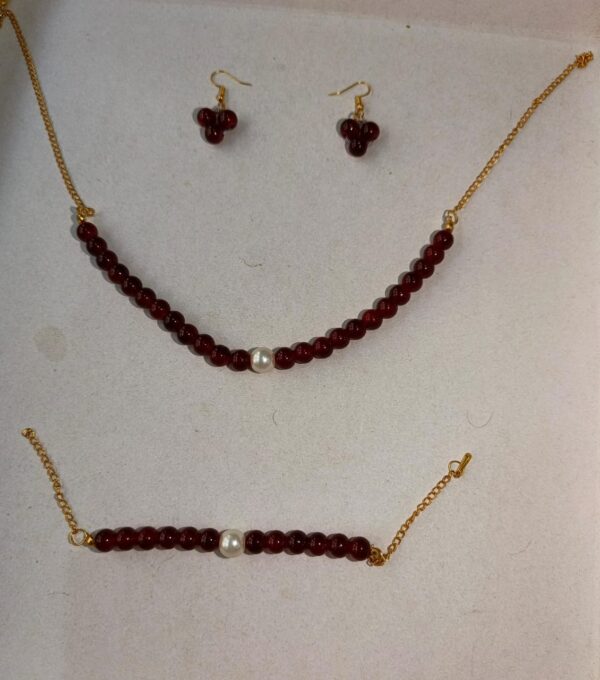 burgundy beaded set with pearl accents