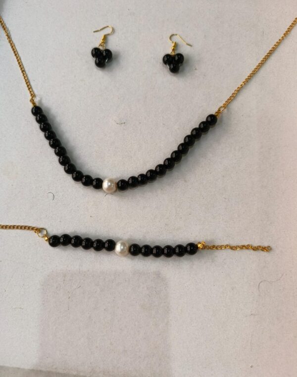 black beaded set with pearl accents