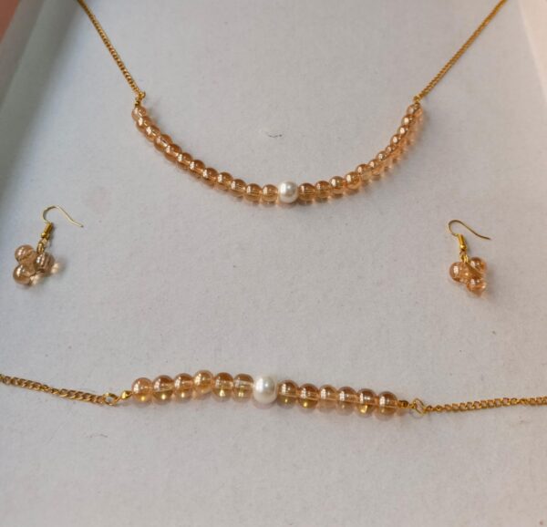 shiny goldish beaded set with pearl accents