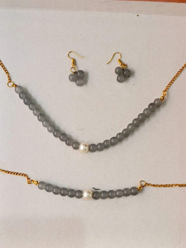 grey beaded set with pearl accents